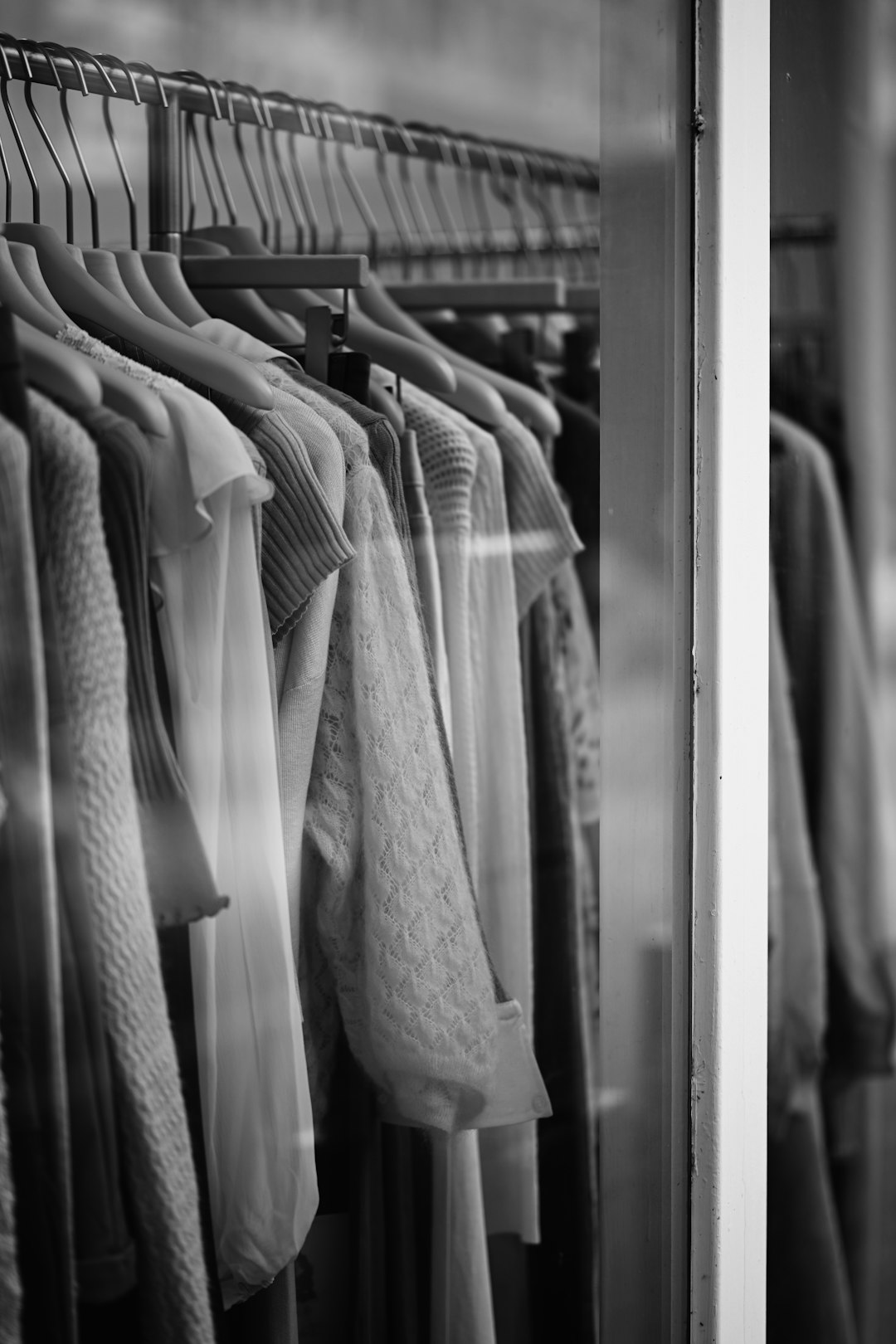 About clothing-on-hangers-in-shop-window-ajxppnffpus