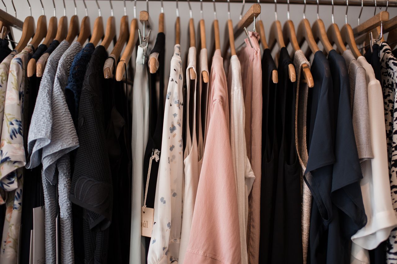 Crafting Captivating Headlines: Your awesome post title goes here A stylish collection of womens clothing hanging on wooden hangers in a boutique setting.
